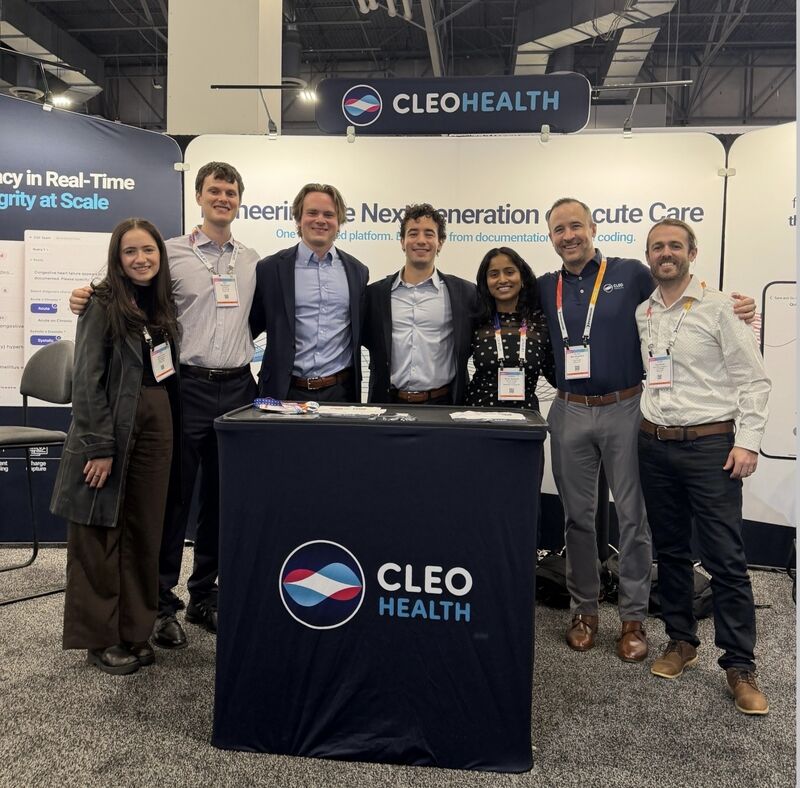 Cleo Health team group photo at booth